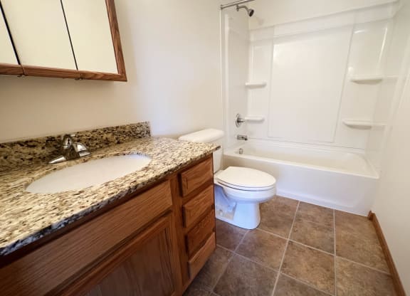 a bathroom with a toilet sink and bathtub  at The Overlook at Ft. Thomas, Ft. Thomas, KY