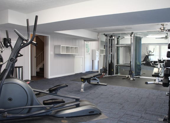 a gym with weights and cardio equipment in a home gym  at Timber Ridge Apartments, Cincinnati, Ohio