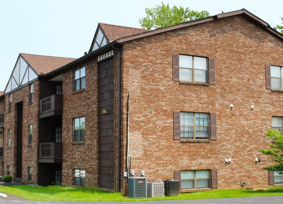 a red brick building with windows on the side of a street  at Four Worlds Apartments, Ohio, 45231
