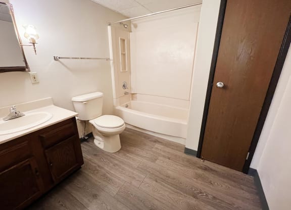 a bathroom with a toilet sink and bathtub  at Devou Village, Ft. Wright, KY, 41011