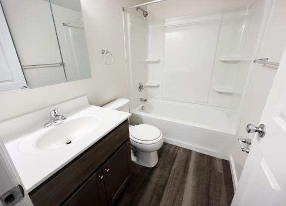 a bathroom with a sink toilet and bathtub  at Timber Ridge Apartments, Ohio