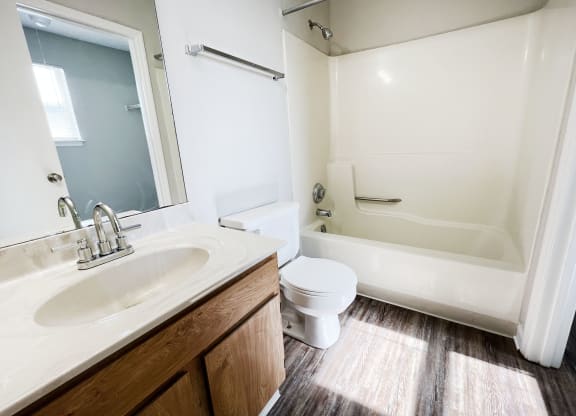 a bathroom with a toilet sink and bathtub at 450 on Keeneland, Richmond