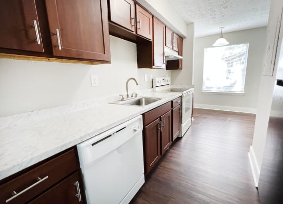a kitchen with white countertops and dark wood cabinets at 450 on Keeneland, Richmond, KY 40475