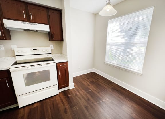 a kitchen with white appliances and wood flooring at 450 on Keeneland, Richmond, 40475