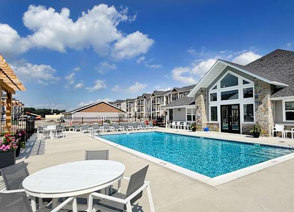 Swimming pool with clubhouse and sundeck seating at The Meridian on 32 Apartments, Ohio