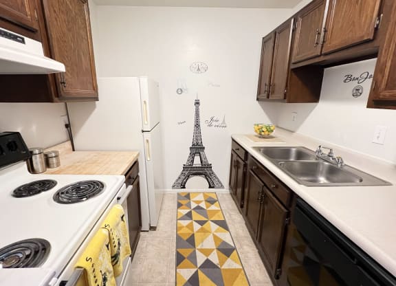 a kitchen with a eiffel tower on the floor at Revere Village Apartments, Centerville