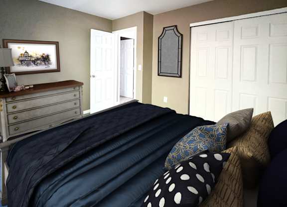 A bedroom with a bed, dresser, and mirror.