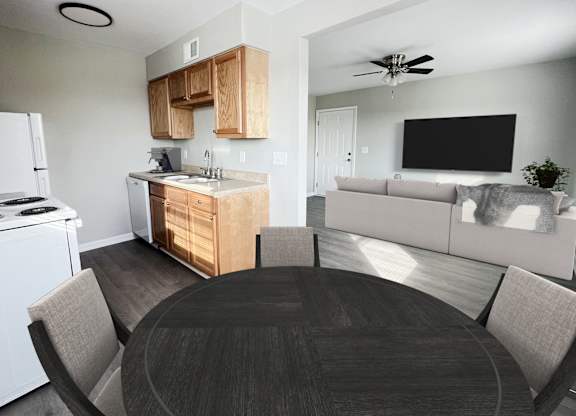 an open kitchen and living room with a dining table and a white stove and refrigerator