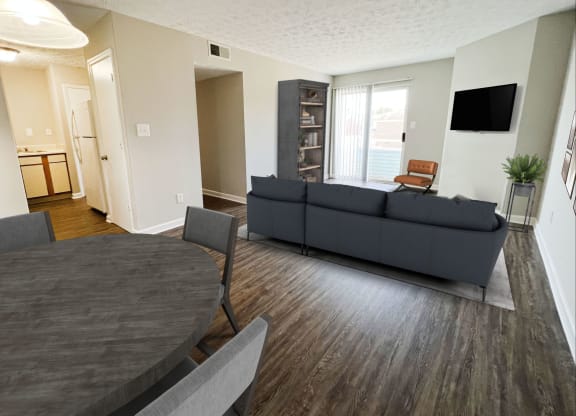 a living room and dining room with a couch at 450 on Keeneland Apartments, Richmond