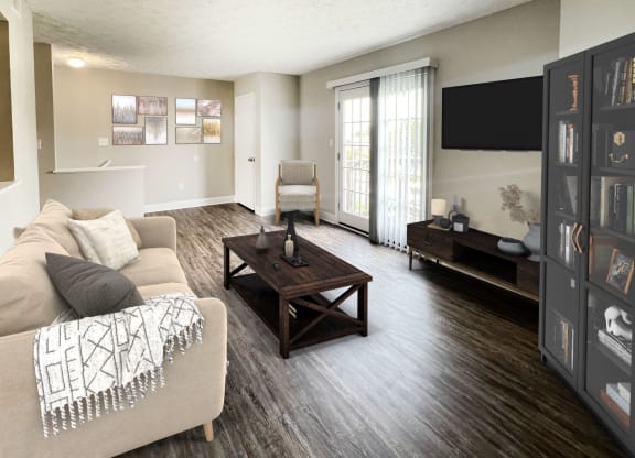 a living room with a couch and a table at 450 on Keeneland Apartments, Richmond, KY 40475