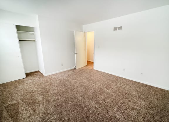 an empty room with carpeting and white walls at Walnut Creek Townhomes, OH