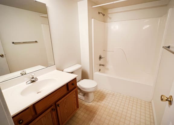 a bathroom with a sink toilet and a shower  at Walton Ridge Apartments, Walton, Kentucky