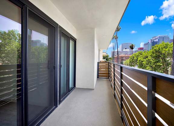 A balcony with a view of the cityscape.
