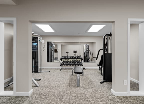 the gym at the enclave at woodbridge apartments in sugar land, tx at Millcreek Woods Apartments, Olathe