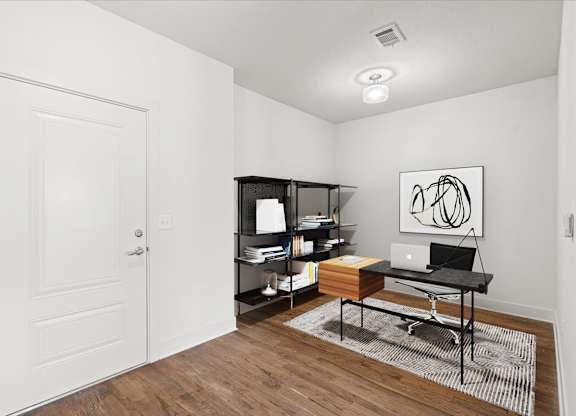 A work room / private study with hardwood floors and a storage closet at The Mirabelle.