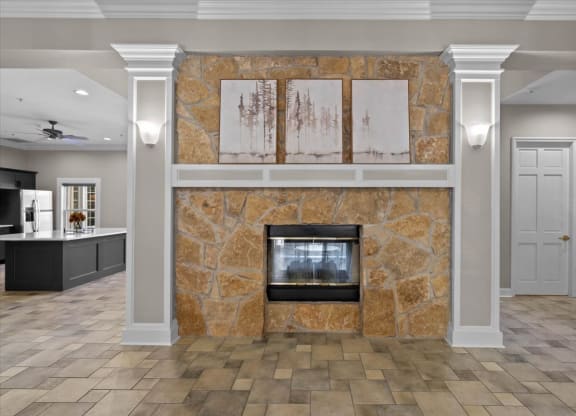 a fireplace in the center of a living room