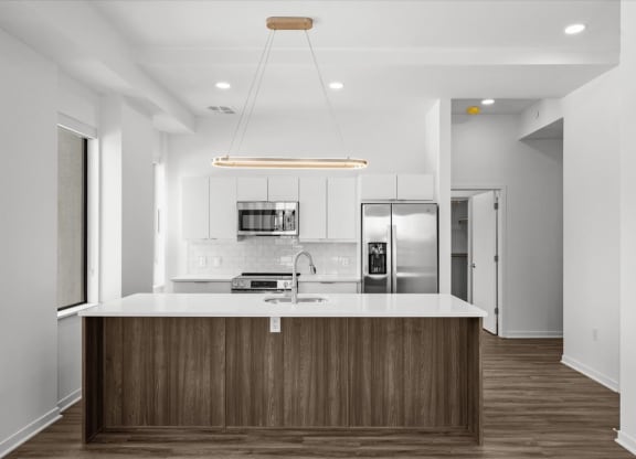 a kitchen with a counter top and a refrigerator