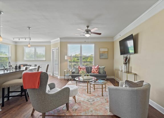 a living room with furniture and a ceiling fan at The Residences at Bluhawk Apartments, Overland Park, KS
