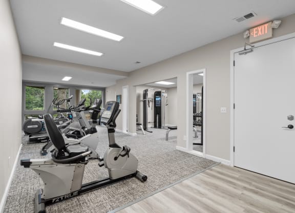 the gym at the whispering winds apartments in pearland, tx at Millcreek Woods Apartments, Olathe, KS