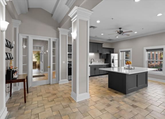 a large kitchen with an island in the middle