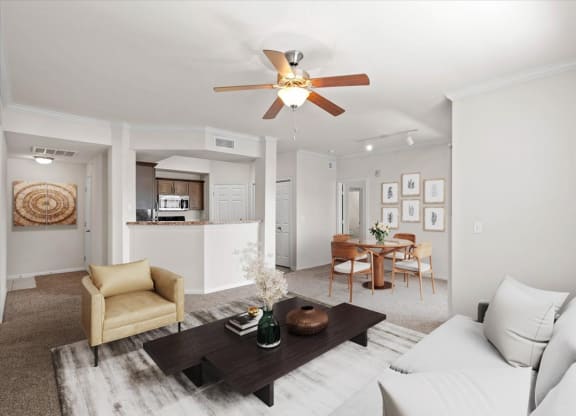 Living area with ceiling fan and dining space.