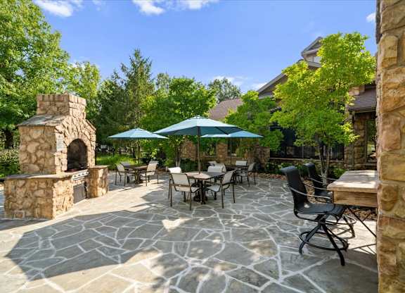 Outdoor patio with Fireplace at Stonepost Ranch Apartments, Kansas