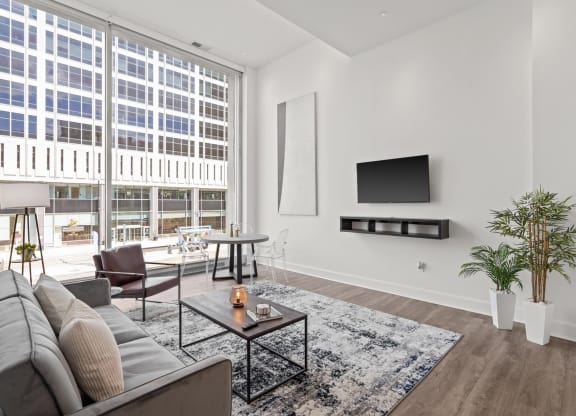 a living room with a large window and a couch