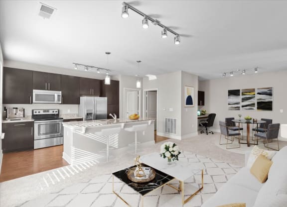 a living room and kitchen with a couch and a table