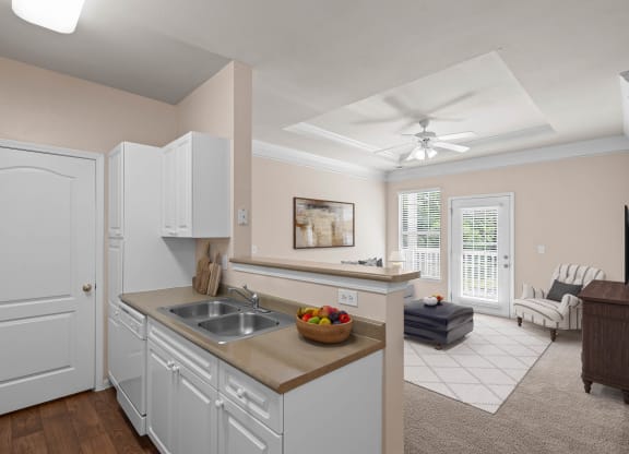 a kitchen and living room in a 555 waverly unit at Creekside, Overland Park, 66213