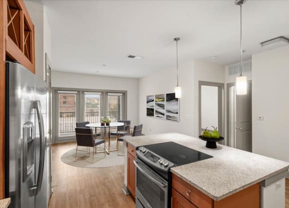 a kitchen and dining area in a 555 waverly unit