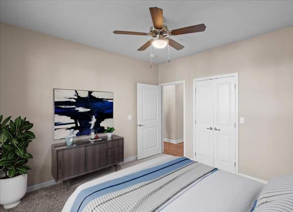 a bedroom with a bed and a ceiling fan at The Dorset, Kansas City, 64112
