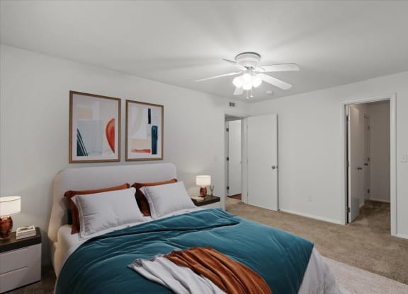 a bedroom with a bed and a ceiling fanat Millcreek Woods Apartments, Kansas, 66061