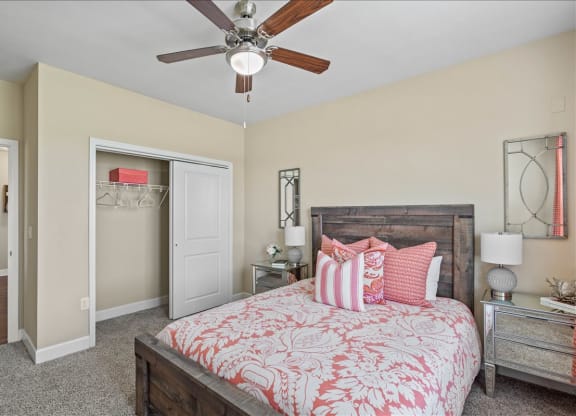 a bedroom with a bed and a ceiling fan at The Residences at Bluhawk Apartment Homes, Overland Park, 66085