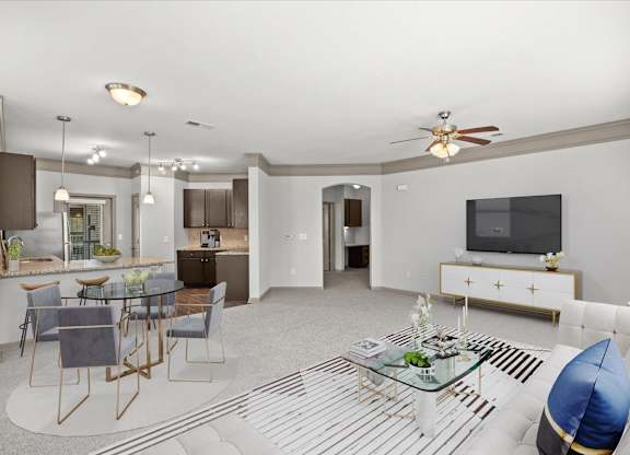 a living room with a couch and a table at Stonepost Crossing Apartments, Overland Park, Kansas