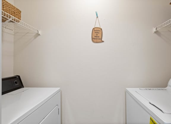 a washer and dryer in a laundry roomat Stonebriar Woods Apartments, Kansas