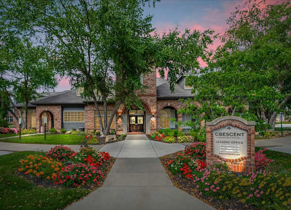 The Crescent Leasing Office is surrounded by a beautiful garden.