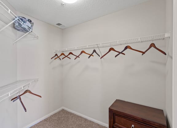 A large walk-in bedroom closet.