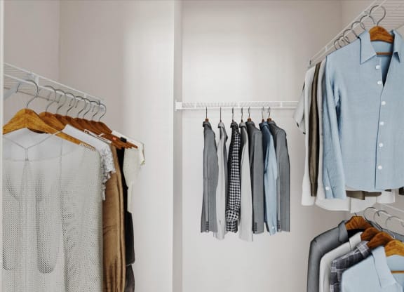 A bedroom closet with wire rack shelves.