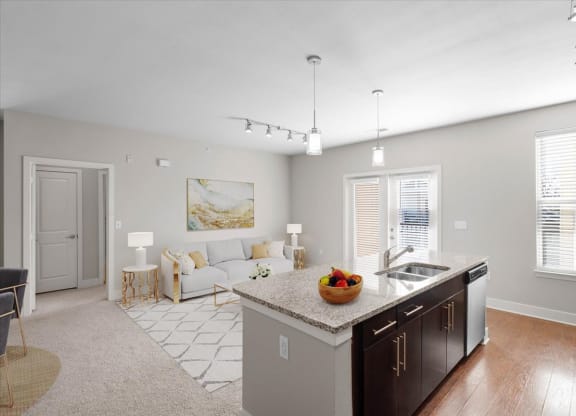 a kitchen and living room with a counter top