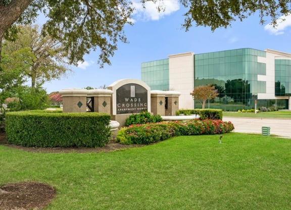 a large building with a grassy area in front of it