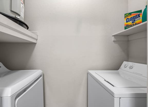 a laundry room with a washer and dryer