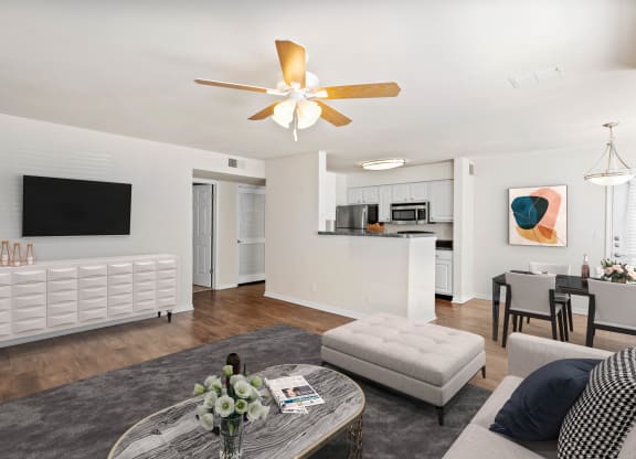 a living room with white walls and a ceiling fanat Stonebriar Woods Apartments, Kansas, 66213