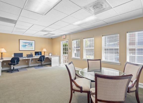 a room with a table and chairs at Stonebriar Apartments, Overland Park