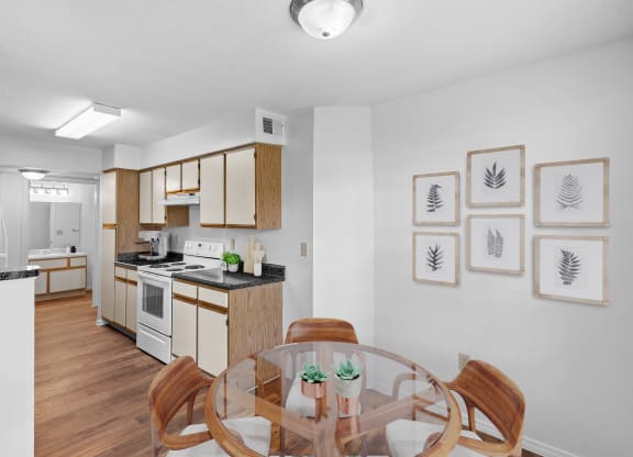 a kitchen and dining area in a 555 waverly unitat Stonebriar Apartments, Kansas, 66213