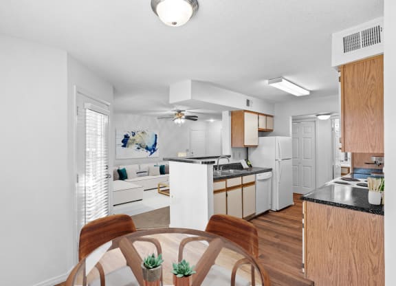 a kitchen and living room in a 555 waverly unitat Stonebriar Apartments, Overland Park, KS, 66213