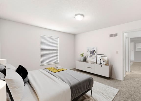 a bedroom with a bed and a dresser