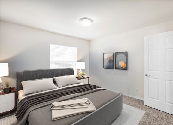 a bedroom with a bed and two nightstandsat Stonebriar Woods Apartments, Kansas, 66213