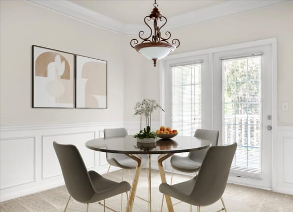 a dining room with a table and chairs