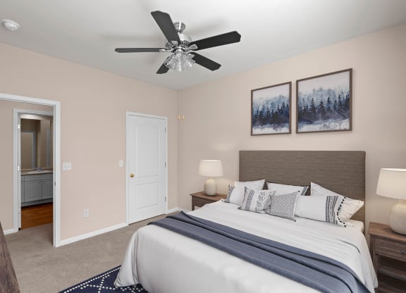 a bedroom with a large bed and a ceiling fan at Creekside, Kansas, 66213