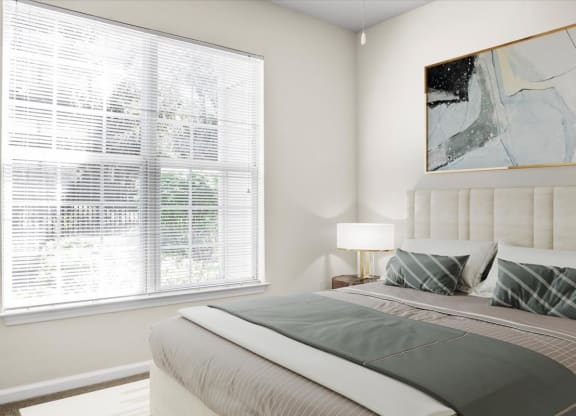 a bedroom with a bed and a large window